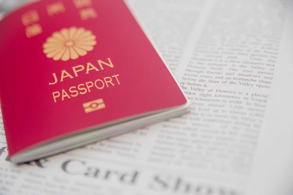 Japanese Passport and English newspaper